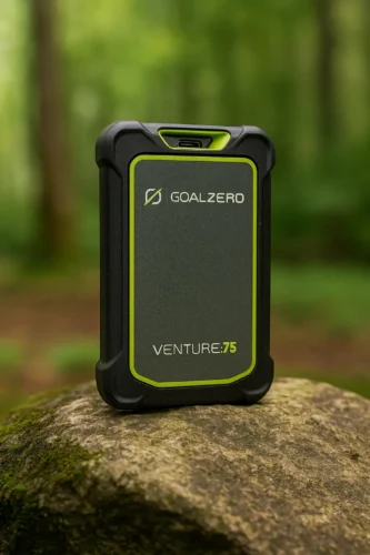 Goal Zero Venture 75 rugged waterproof power bank standing on mossy rock with forest background