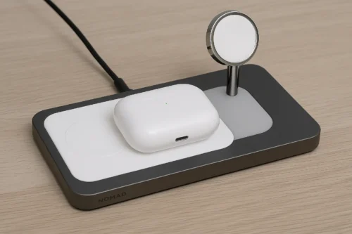 Nomad Base One Max 3-in-1 MagSafe charger for iPhone, Apple Watch, and AirPods on wooden desk