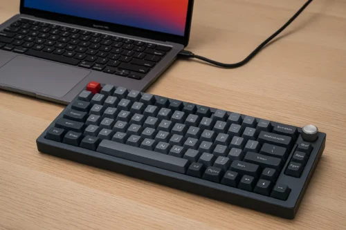 Keychron Q1 Pro mechanical keyboard connected to MacBook on a wooden desk